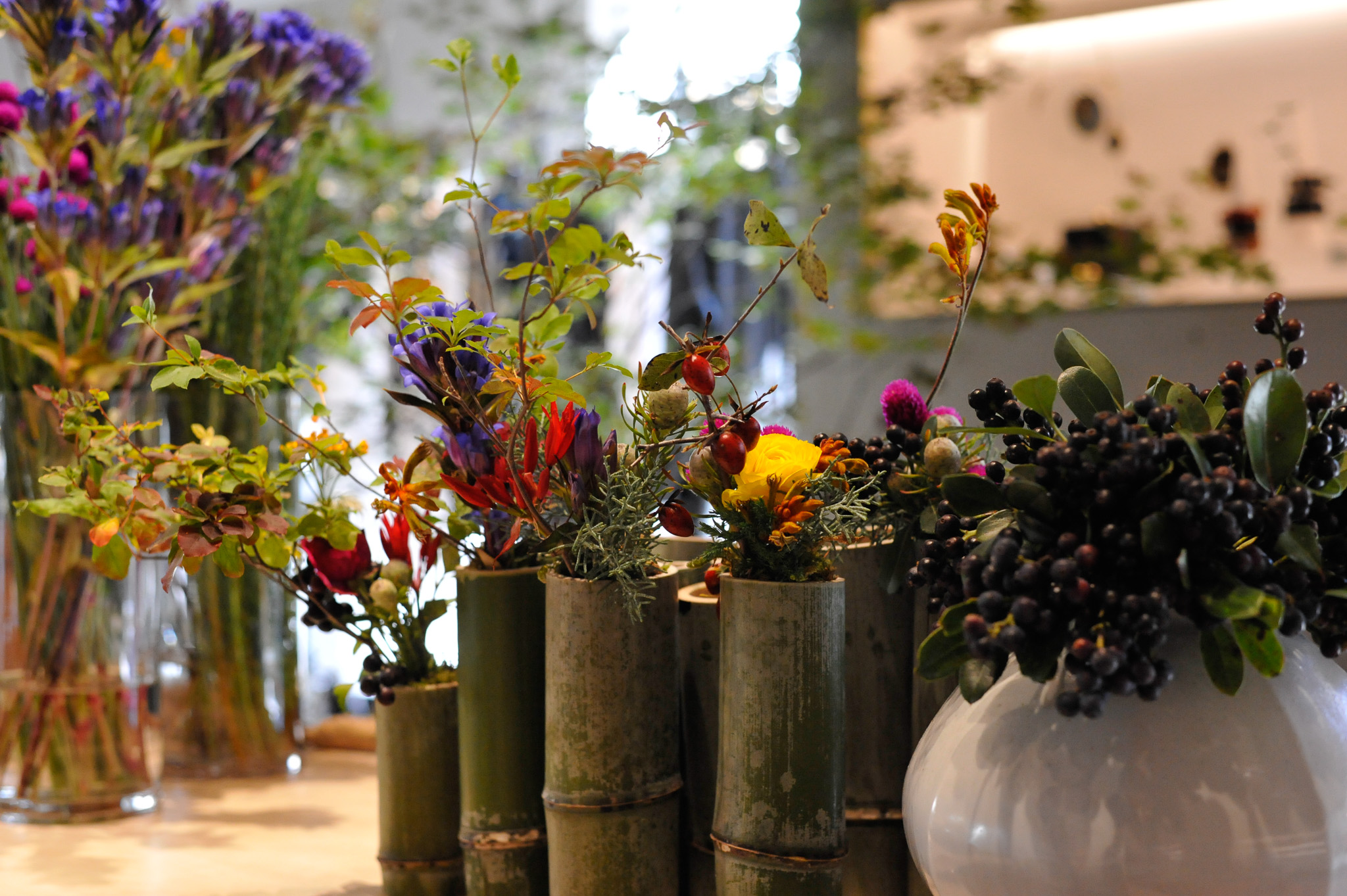 Hands arranging flowers during workshop