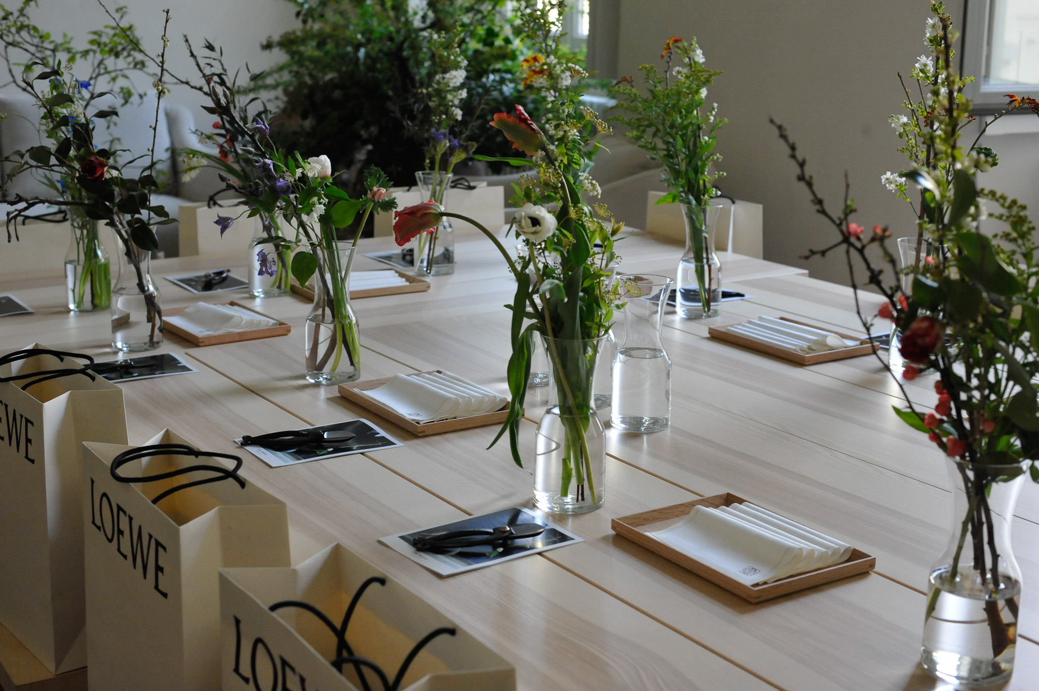 Prepared workshop table with floral materials